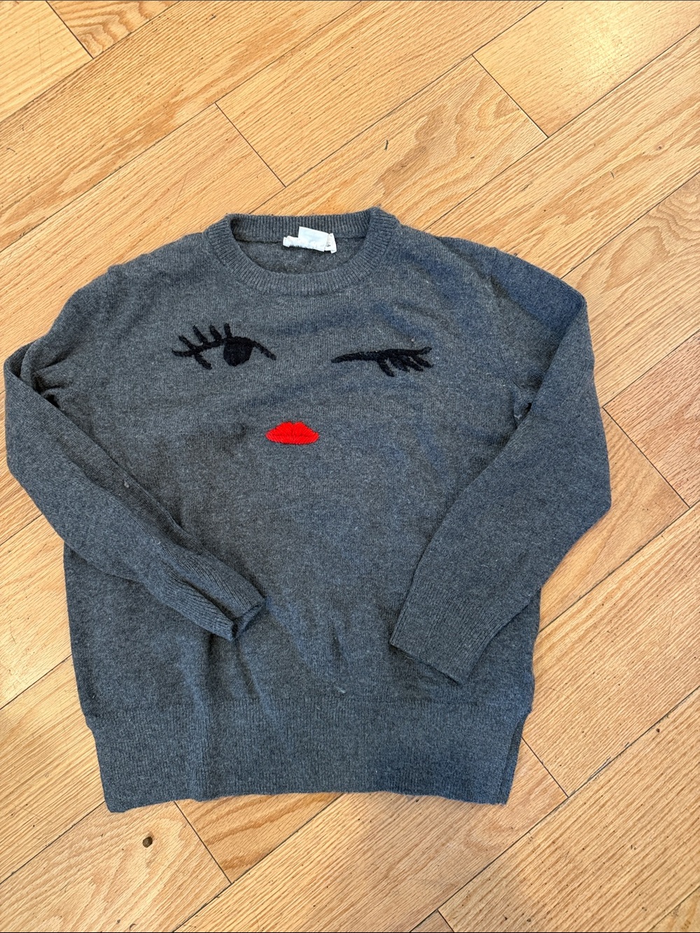 kate spade Charcoal Crewneck Sweater with Red Lip Face Motif